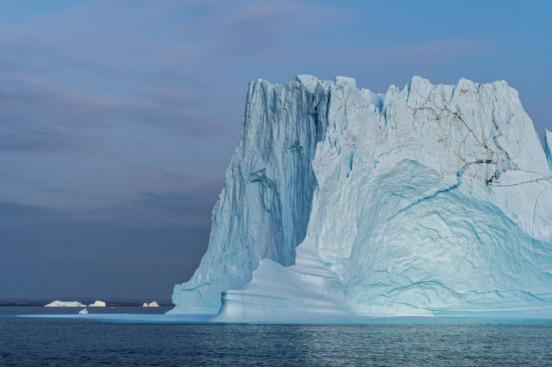 Arctic landscape with icebergs and polar bear