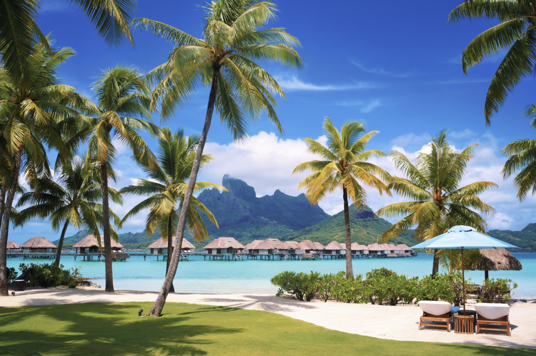 Airplane descending over Bora Bora's lagoon